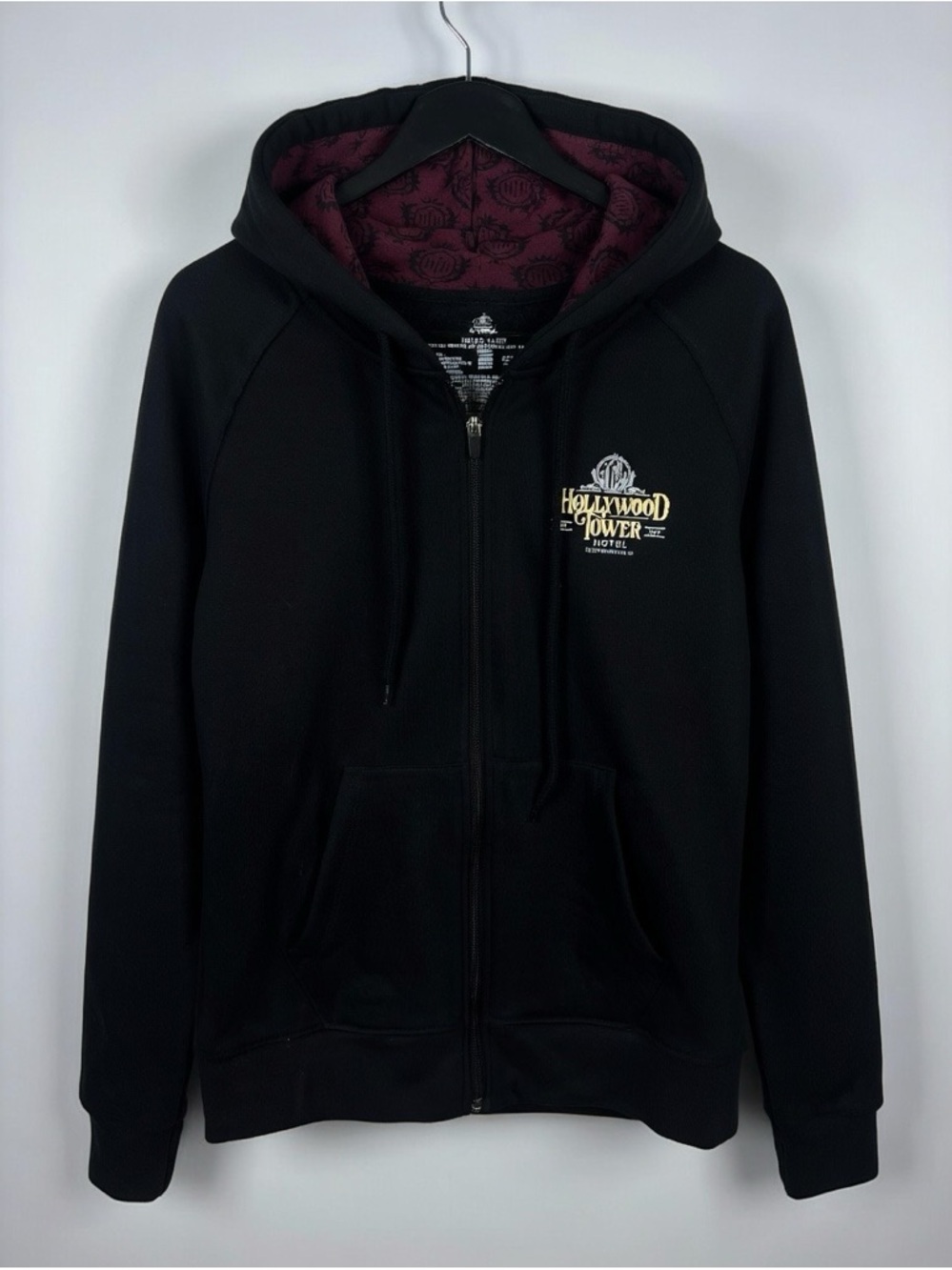 Disney 1939 Hollywood Tower Hotel Black Zip-Up Hoodie with Purple Lining